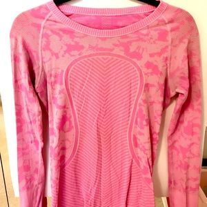 Pink women’s Lululemon fitted workout top